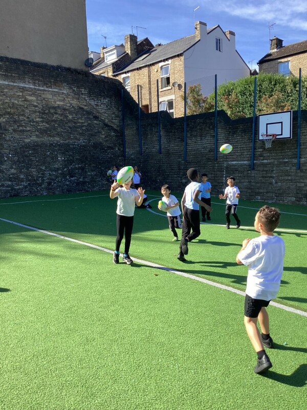 Y3 playing rugby.